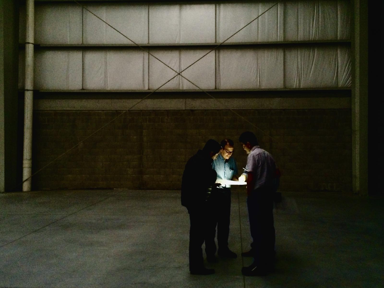 Jan reviews the floor plan with company team leaders. Photo Courtesy of Mr. Dieter Bischoff from Manroland.